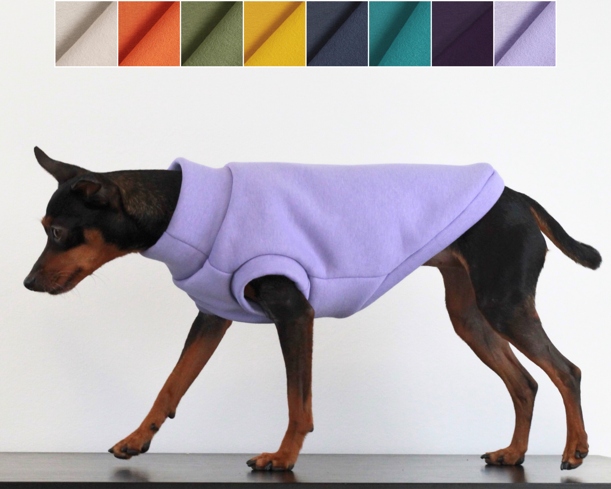Dog wearing a lilac fleece sleeveless jumper with color swatches above. Lana Royals Pet Wear Store.